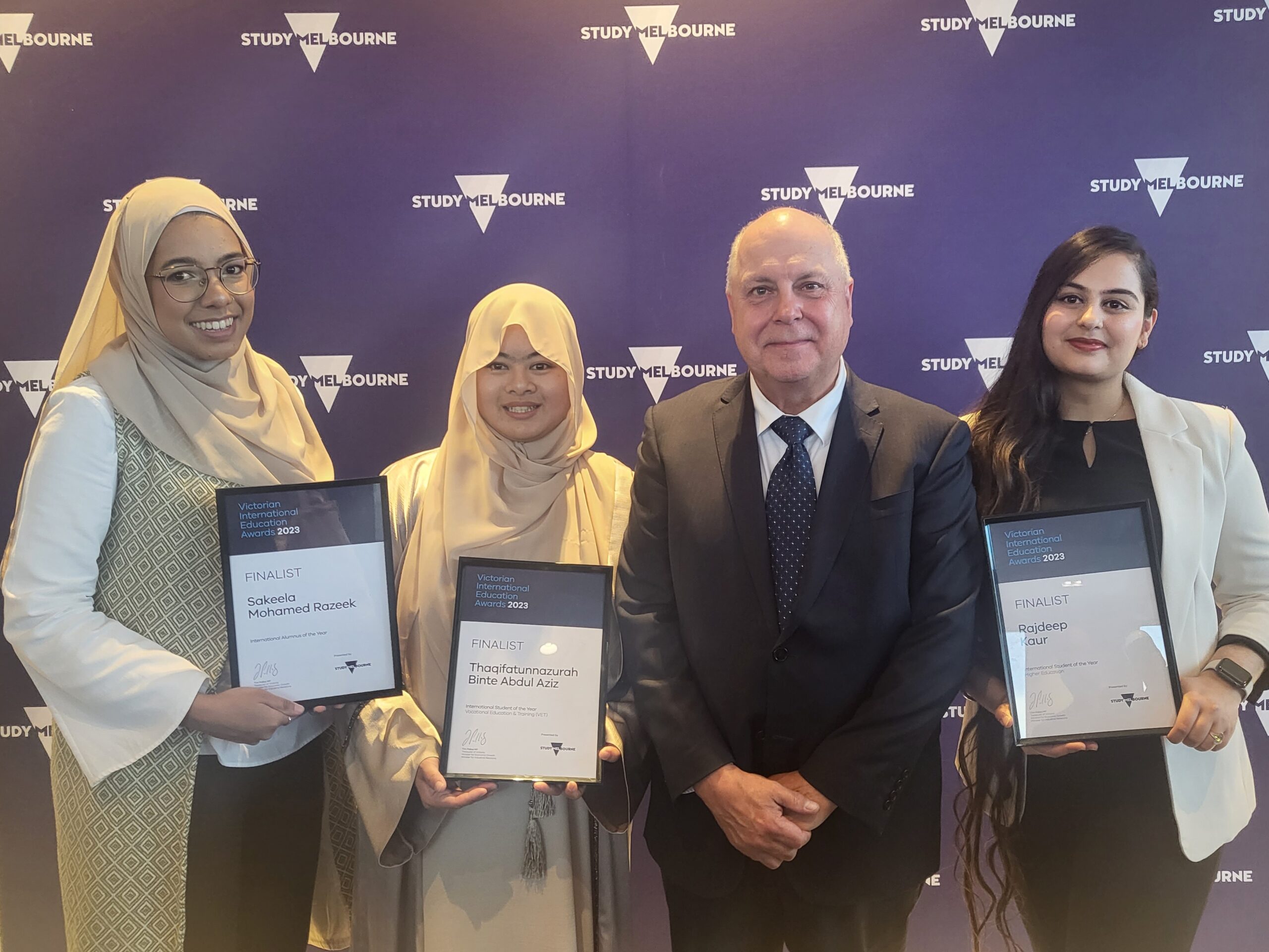 Victorian International Education Awards finalist Thaqifatunnazurah Binte Abdul Aziz with Victorian Treasurer Tim Pallas MP and other finalists.